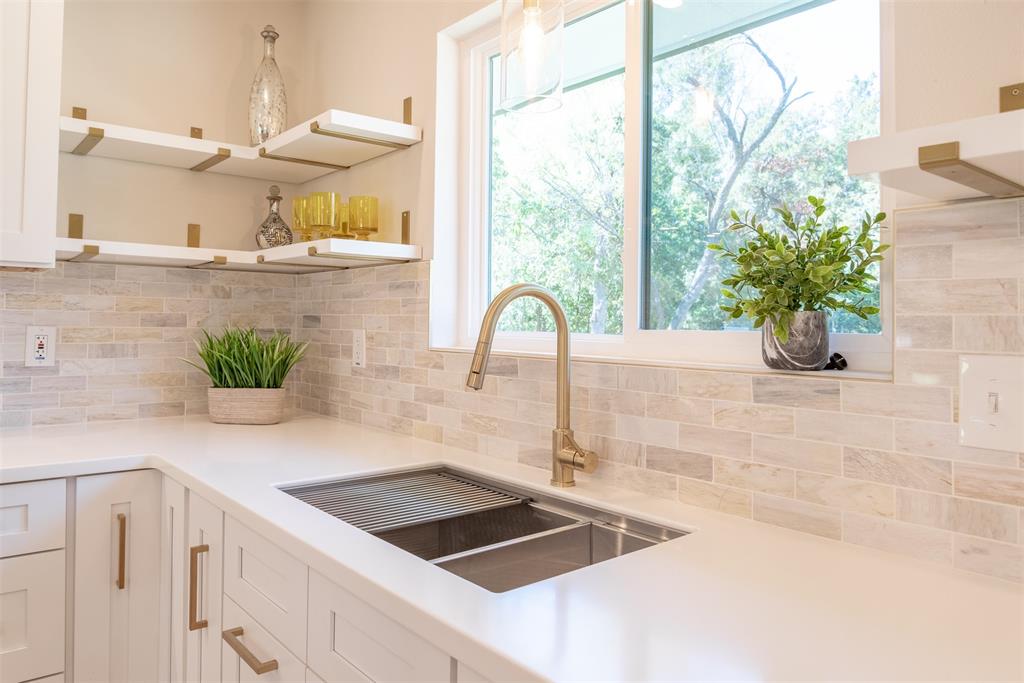 210 Davis Road Granbury, TX 76049 - Photo 23 of 28 a kitchen with a sink and a large window