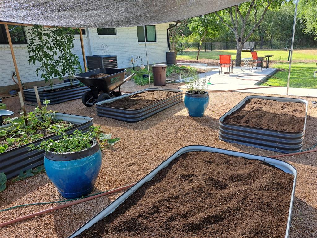 210 Davis Road Granbury, TX 76049 - Photo 27 of 28 a building outdoor space with patio furniture and potted plants