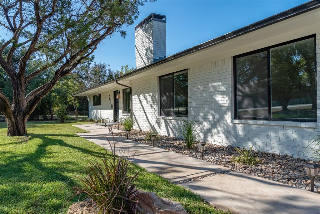 210 Davis Road Granbury, TX 76049 - Photo 5 of 28 a view of a house with backyard