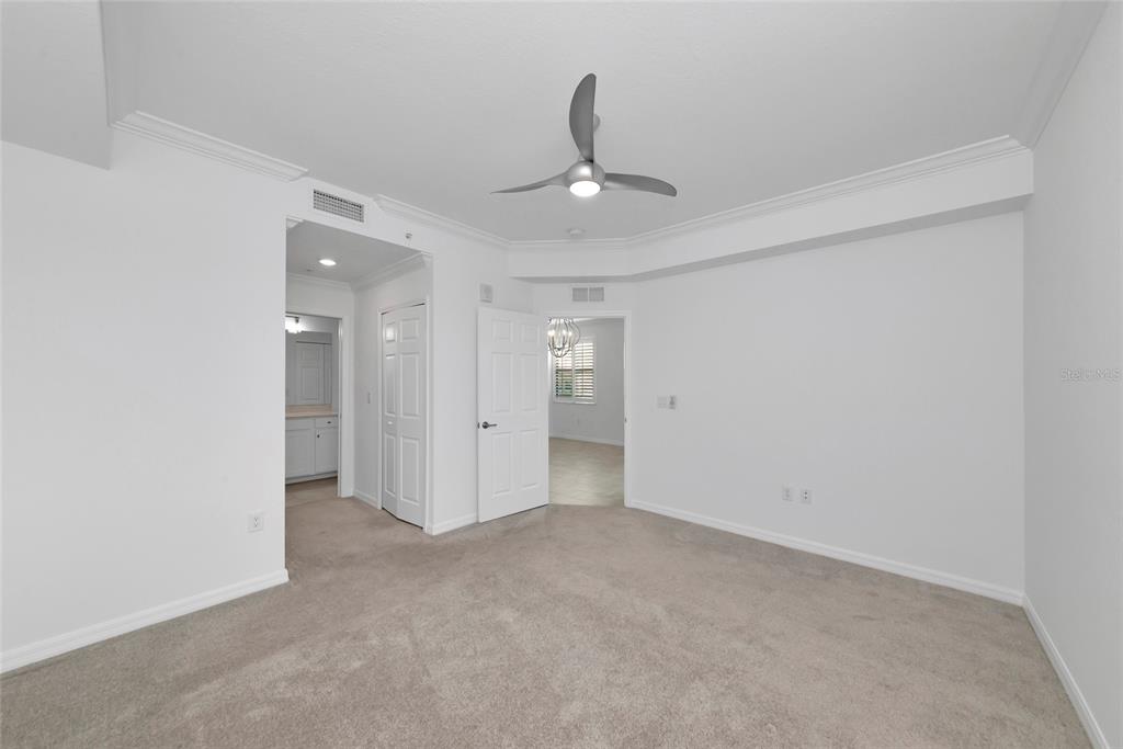 18008 Gawthrop Drive, Unit 101 Lakewood Ranch, FL 34211 - Photo 20 of 56 an empty room with closet and a ceiling fan