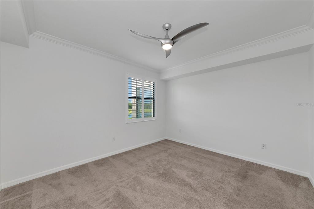 18008 Gawthrop Drive, Unit 101 Lakewood Ranch, FL 34211 - Photo 22 of 56 an empty room with a window and a ceiling fan