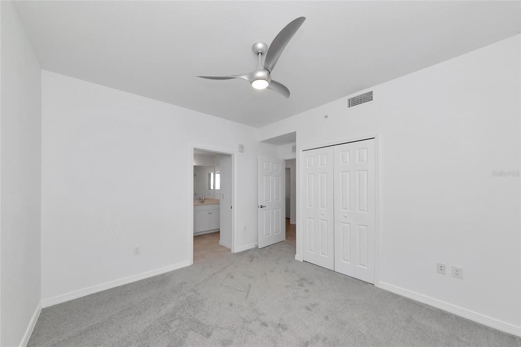 18008 Gawthrop Drive, Unit 101 Lakewood Ranch, FL 34211 - Photo 31 of 56 an empty room with closet and a ceiling fan