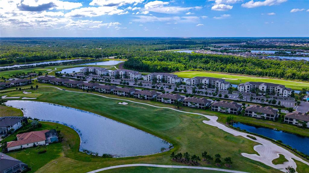 18008 Gawthrop Drive, Unit 101 Lakewood Ranch, FL 34211 - Photo 52 of 56 a view of an outdoor space with a lake view