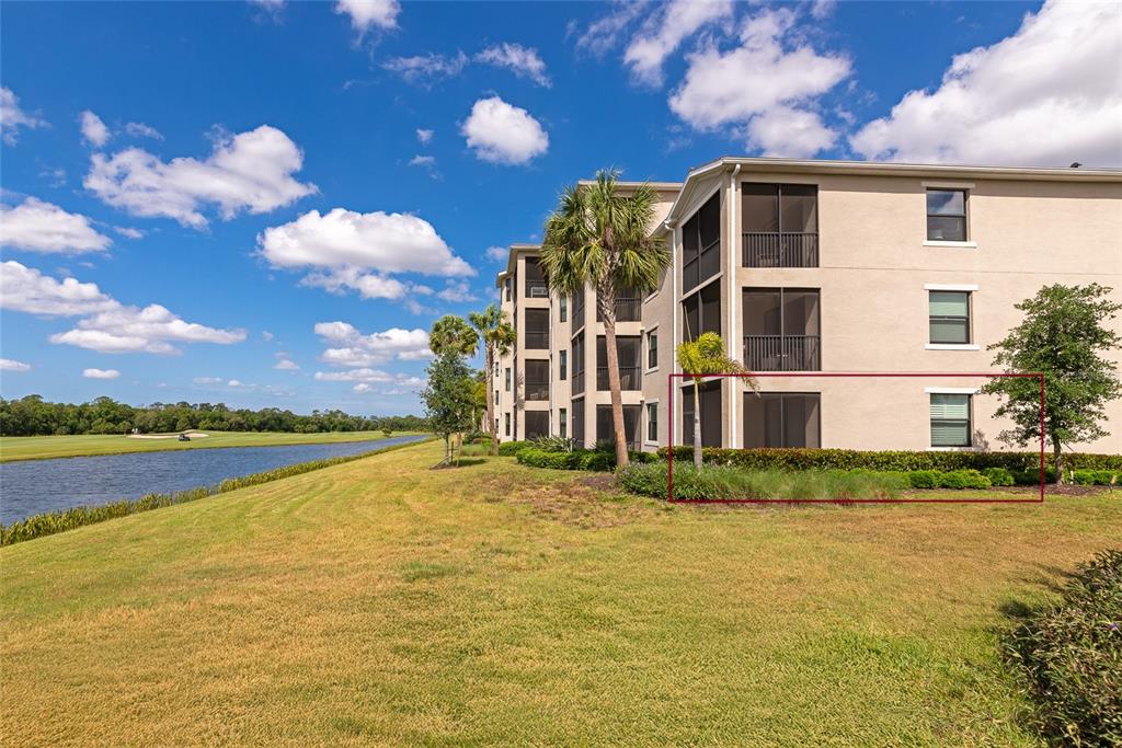 18008 Gawthrop Drive, Unit 101 Lakewood Ranch, FL 34211 - Photo 54 of 56 a front view of a house with a yard