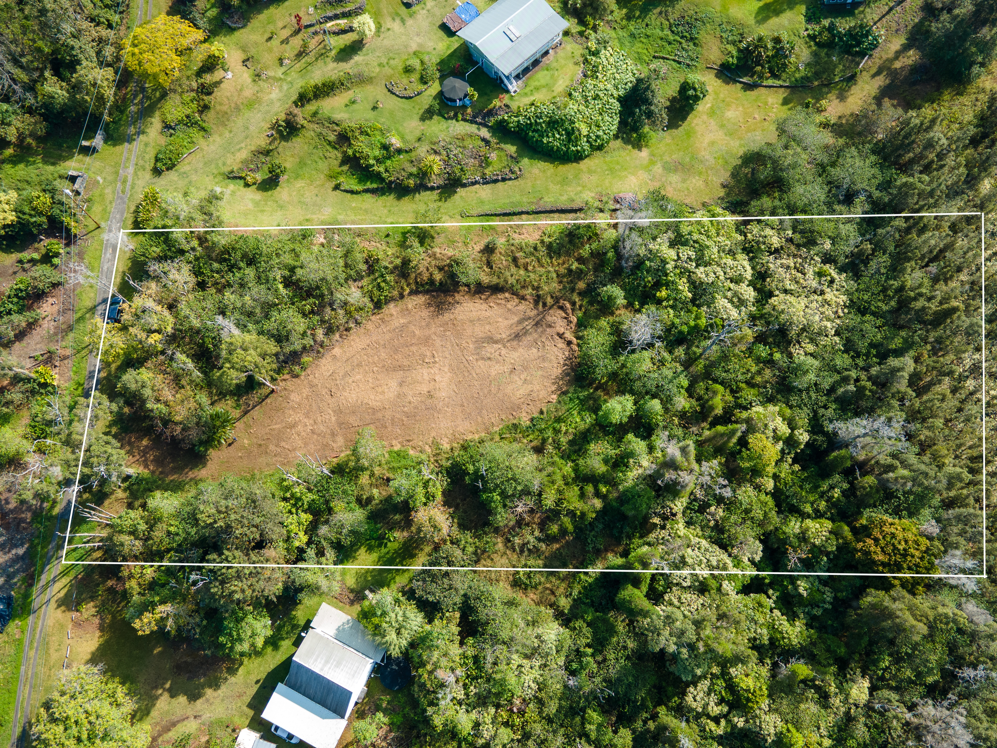 89-806 Lot 28 Huanui Road Captain Cook, HI 96704 - Photo 2 of 16 an aerial view of a house with a lake view