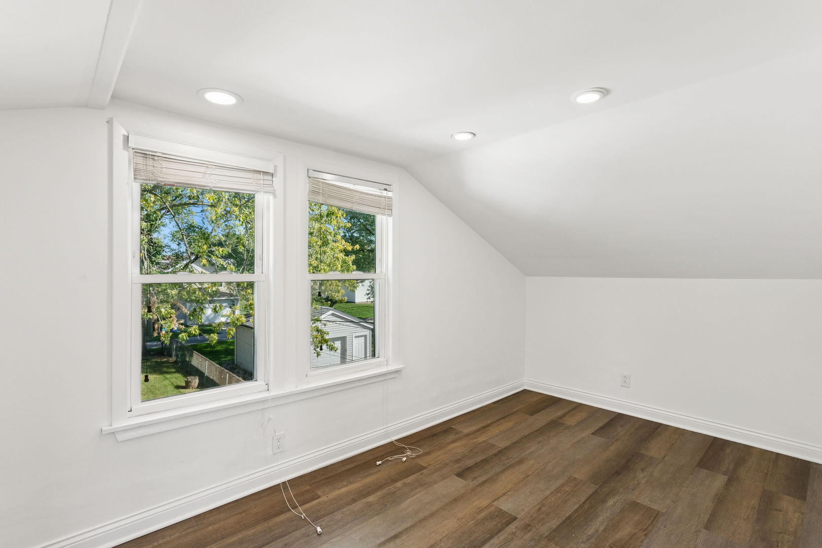 540 East 4th Street Lockport, IL 60441 - Photo 14 of 24 an empty room with wooden floor and windows