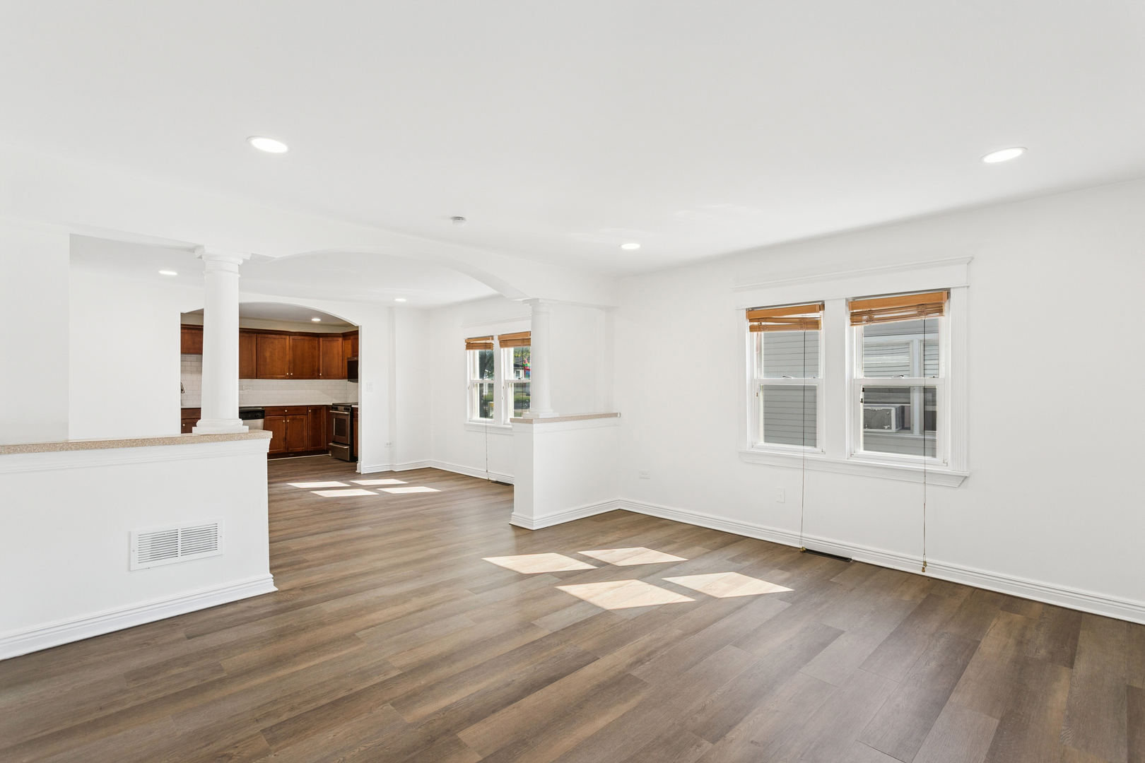 540 East 4th Street Lockport, IL 60441 - Photo 5 of 24 an empty room with wooden floor and windows
