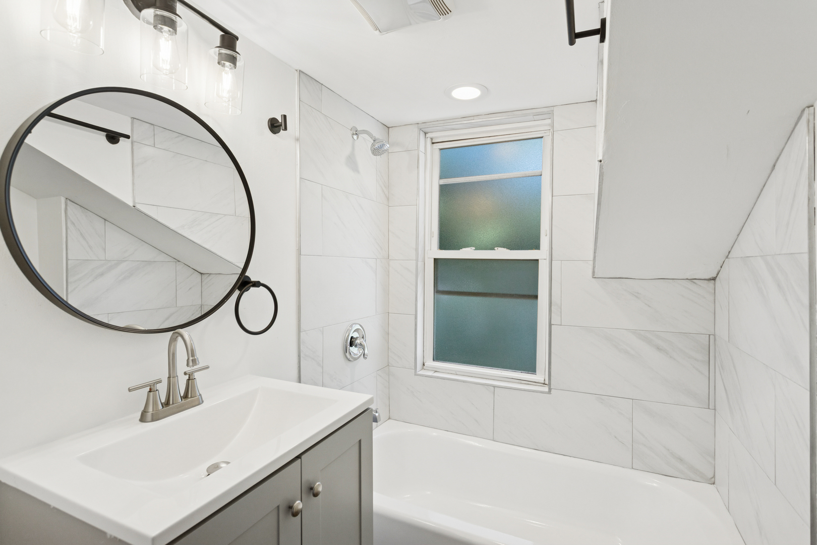 540 East 4th Street Lockport, IL 60441 - Photo 10 of 24 a bathroom with a sink and a mirror