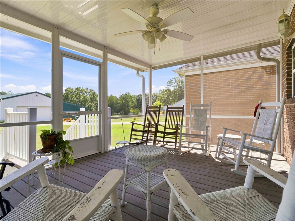 2861 Fairview Road Simpsonville, SC 29680 - Photo 26 of 42 Wood flooring and screened enclosures define this relaxing outdoor retreat overlooking the backyard.