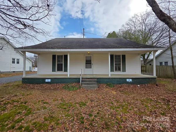 a house with trees in the background