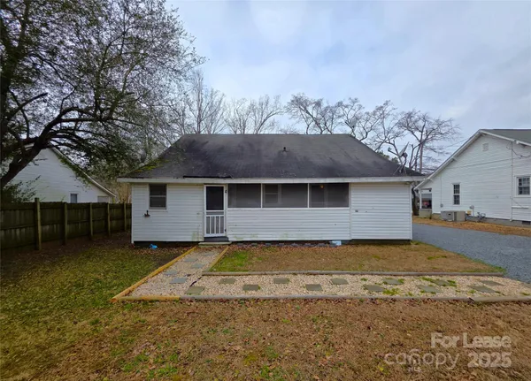 a view of a house with a yard and garage