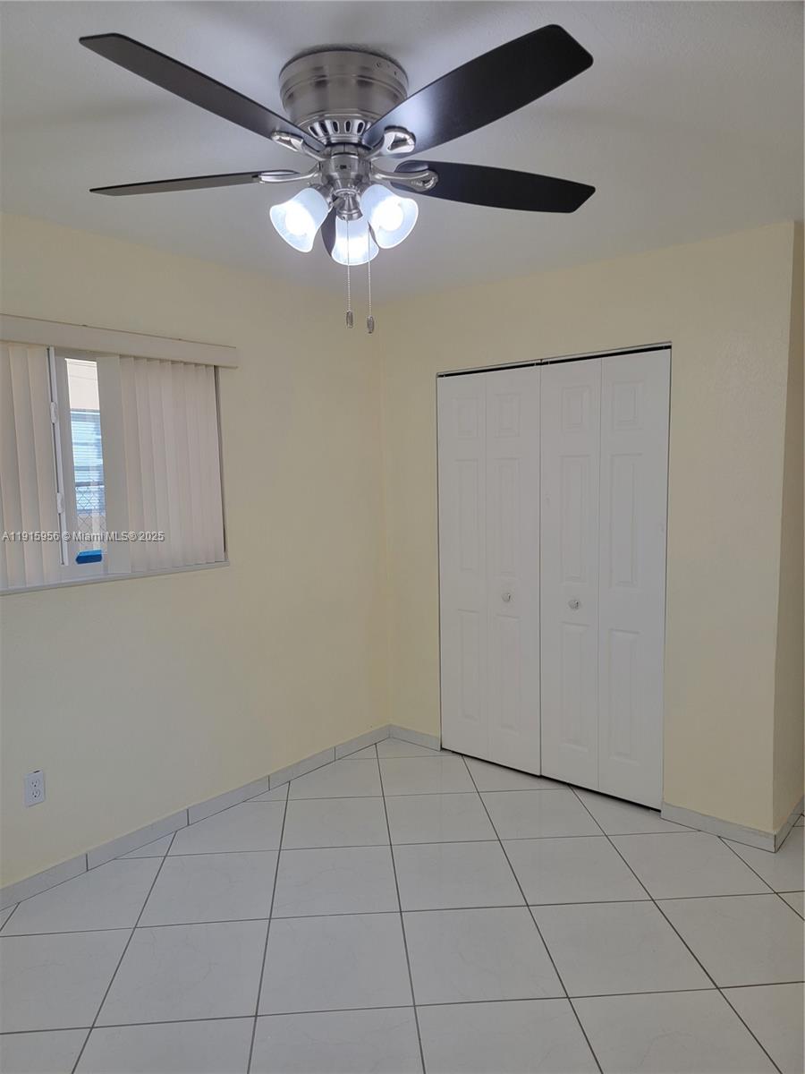 1037 West 23rd Street Hialeah, FL 33010 - Photo 14 of 41 a view of an empty room with a window