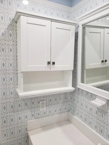 a close view of a sink and a cabinet in a bathroom