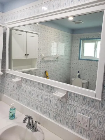 a bathroom with a bathtub and a sink