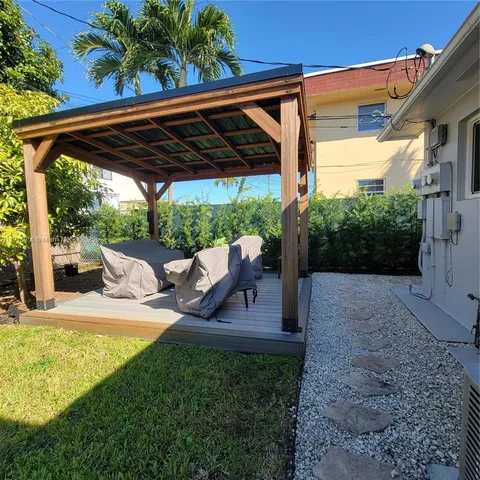 a view of yard with patio