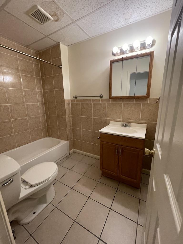 4429 Steuben Road, Unit 101 Bethlehem, PA 18020 - Photo 5 of 10 Functional full bathroom with tiled shower surround and a practical vanity setup.