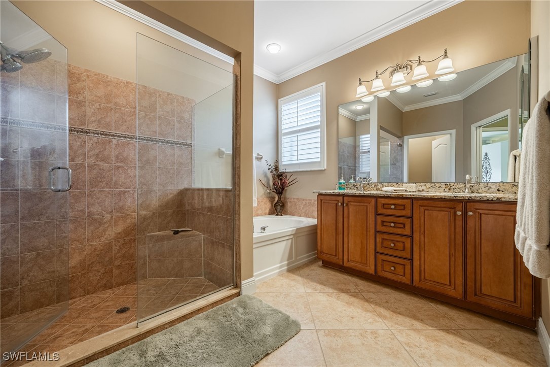 12977 Turtle Cove Trail North Fort Myers, FL 33903 - Photo 11 of 45 a spacious bathroom with a granite countertop sink a toilet a mirror and shower