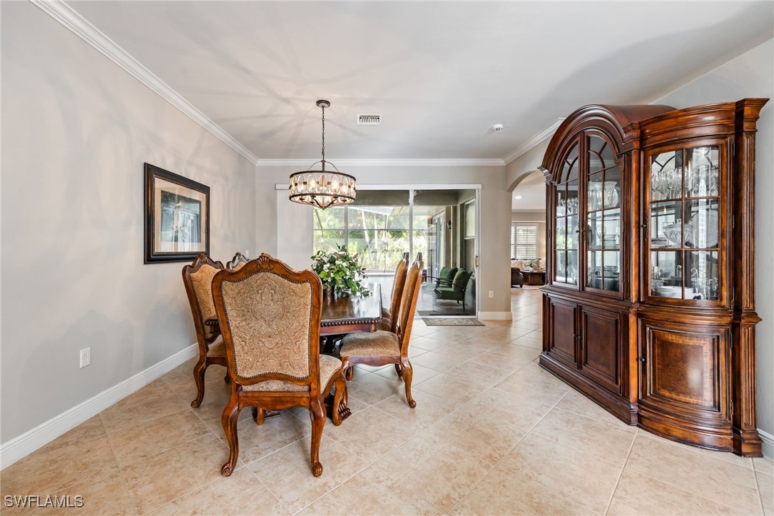 12977 Turtle Cove Trail North Fort Myers, FL 33903 - Photo 13 of 45 a view of a dining room with furniture window and wooden floor