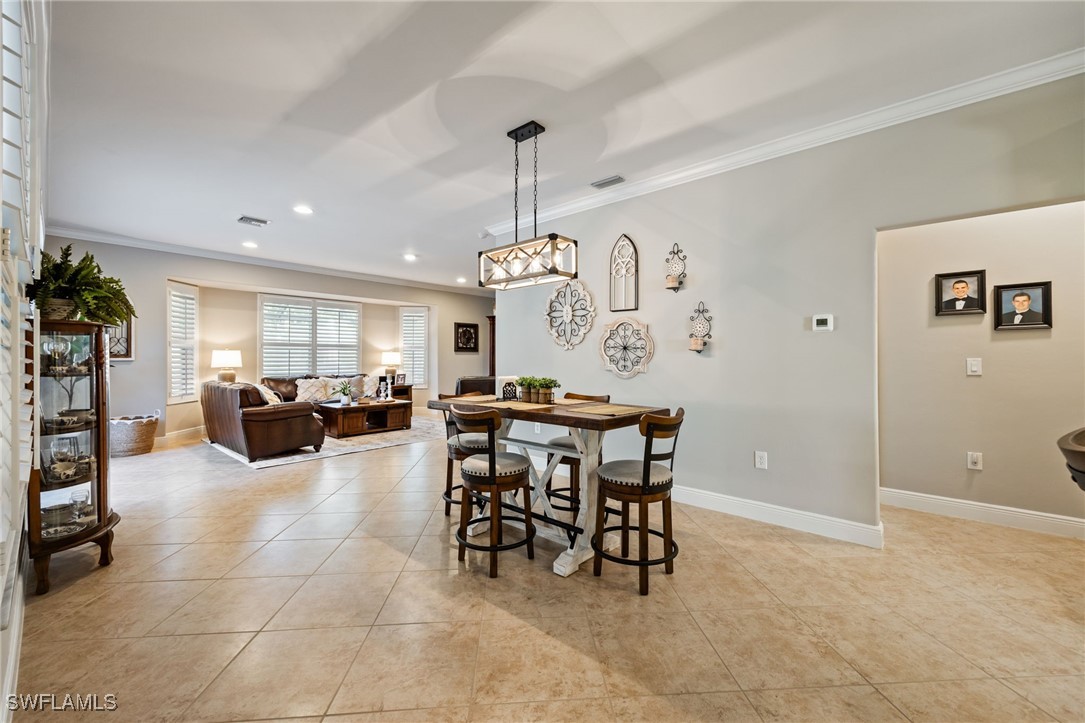 12977 Turtle Cove Trail North Fort Myers, FL 33903 - Photo 19 of 45 a view of a livingroom and a dining room
