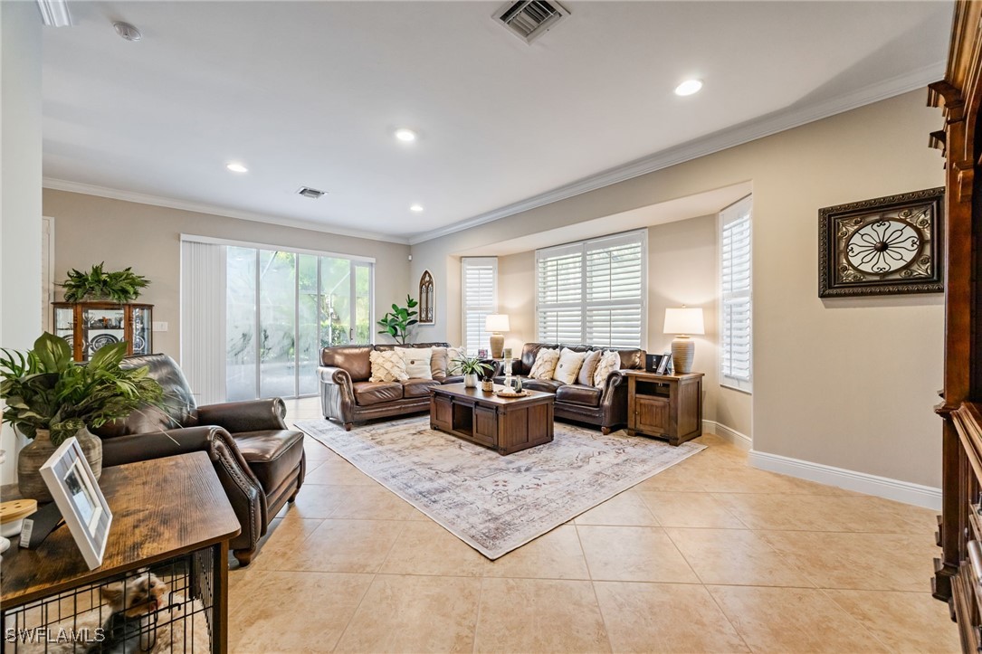12977 Turtle Cove Trail North Fort Myers, FL 33903 - Photo 28 of 45 a living room with furniture potted plant and a window