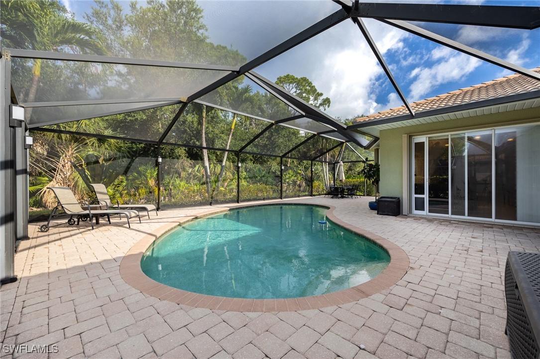 12977 Turtle Cove Trail North Fort Myers, FL 33903 - Photo 32 of 45 a view of a swimming pool with porch