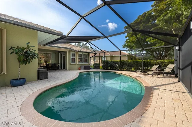 a view of a swimming pool with sitting area