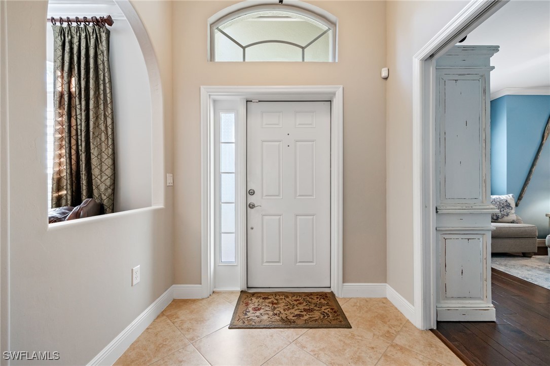 12977 Turtle Cove Trail North Fort Myers, FL 33903 - Photo 4 of 45 a view of a hallway to a livingroom with furniture