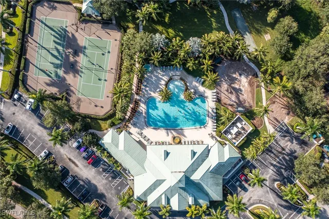 an aerial view of a house with a yard and garden