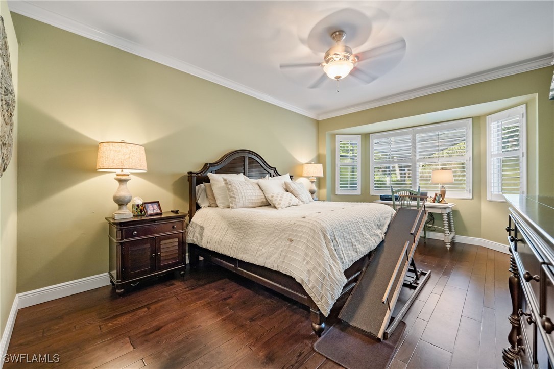 12977 Turtle Cove Trail North Fort Myers, FL 33903 - Photo 8 of 45 a bedroom with a bed and a chandelier