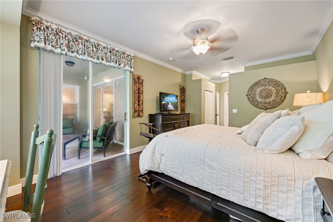 12977 Turtle Cove Trail North Fort Myers, FL 33903 - Photo 9 of 45 a bedroom with a bed and a chandelier