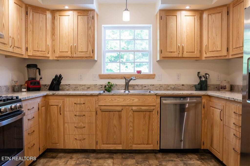 1518 Cummingsville And Sparkman Road Doyle, TN 38559 - Photo 28 of 58 a kitchen with granite countertop cabinets stainless steel appliances a sink and window