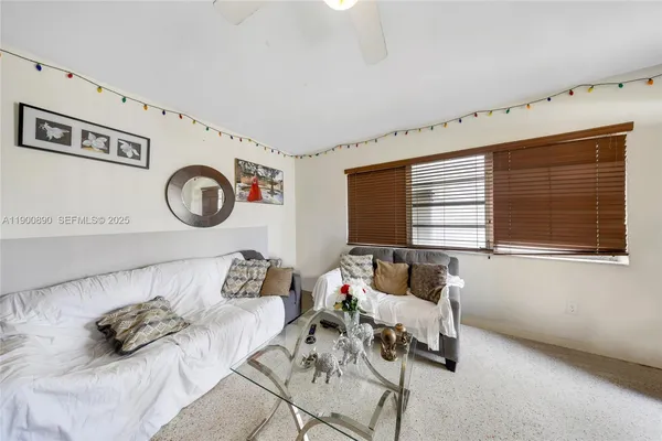 a bedroom with furniture and a window