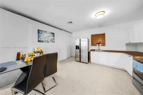 a workspace with furniture and a window