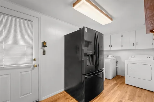 a kitchen with stainless steel appliances a refrigerator and a stove top oven