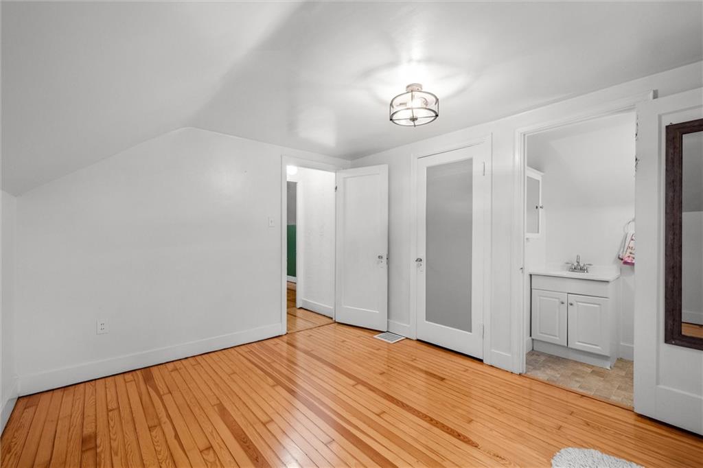 429 Marwood Road Cabot, PA 16023 - Photo 14 of 35 a view of an empty room with chandelier fan and wooden floor