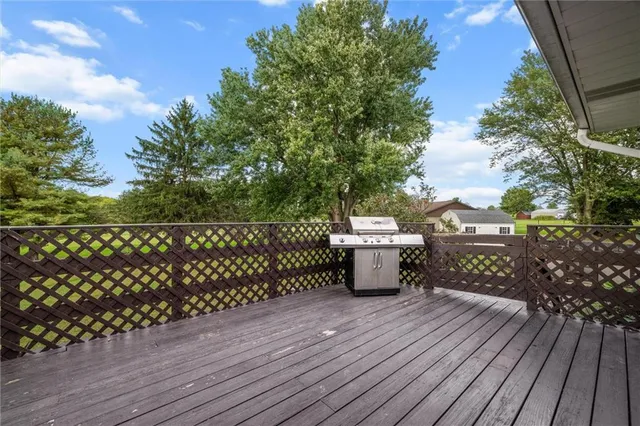 a view of a balcony with wooden floor