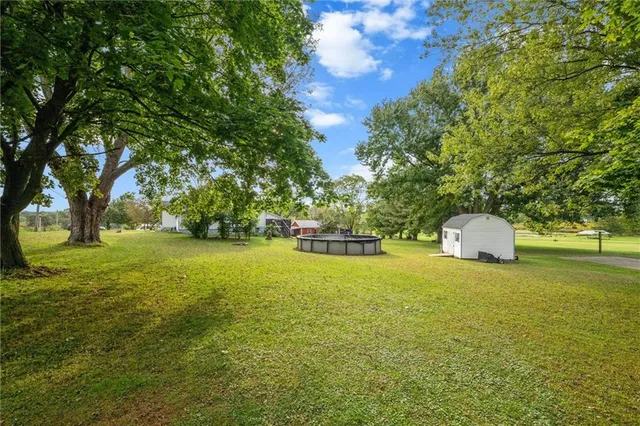 an aerial view of a golf course with a ocean view