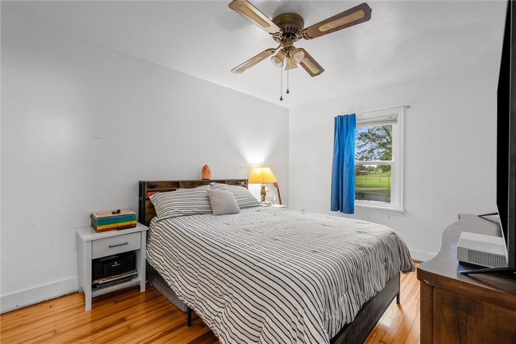 429 Marwood Road Cabot, PA 16023 - Photo 10 of 35 a bedroom with a bed and wooden floor