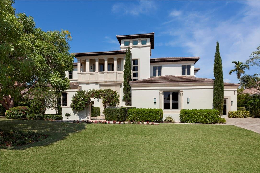 23 Saranac Road Sea Ranch Lakes, FL 33308 - Photo 1 of 29 a front view of a house with a garden