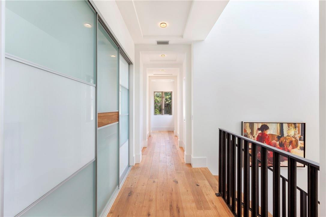 23 Saranac Road Sea Ranch Lakes, FL 33308 - Photo 17 of 29 a view of hallway with wooden floor