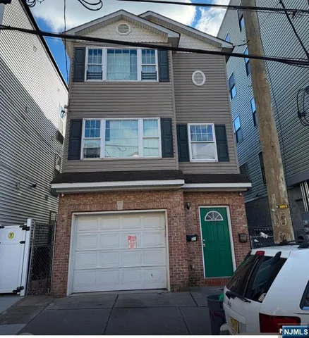 a front view of a house with a garage