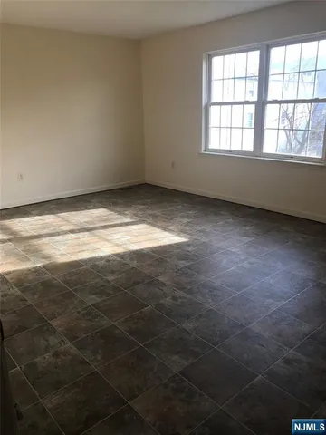 a bathroom with a toilet sink vanity and mirror