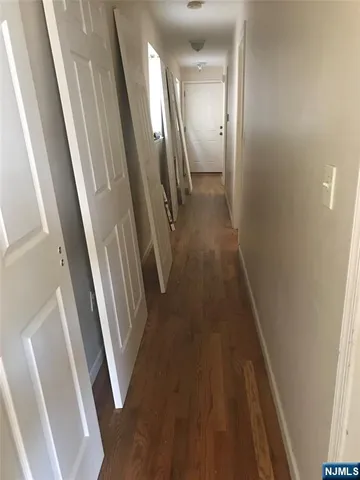 a bed sitting in a bedroom next to a bathroom