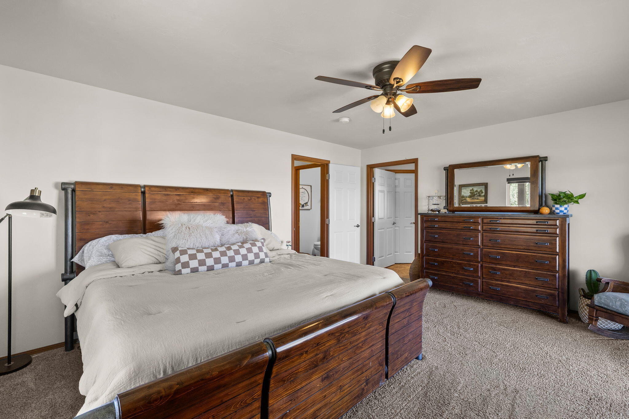 63639 Gentry Loop Bend, OR 97701 - Photo 17 of 40 a bedroom with a bed and ceiling fan