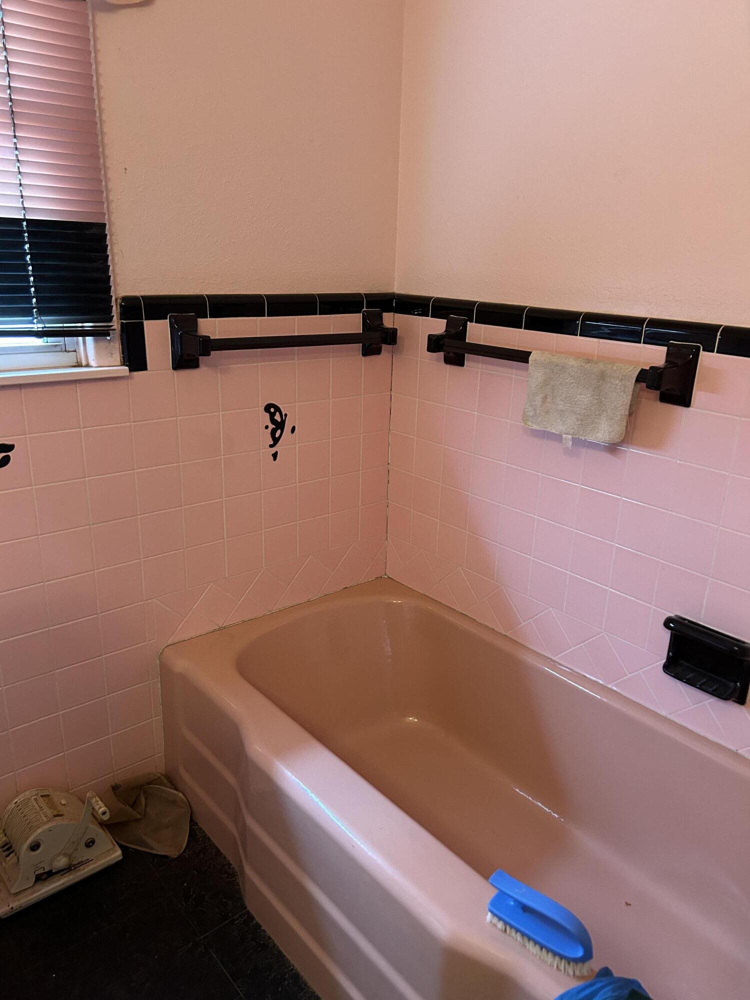2802 Walnut Avenue Lubbock, TX 79404 - Photo 8 of 13 a bathroom with a shower and bathtub
