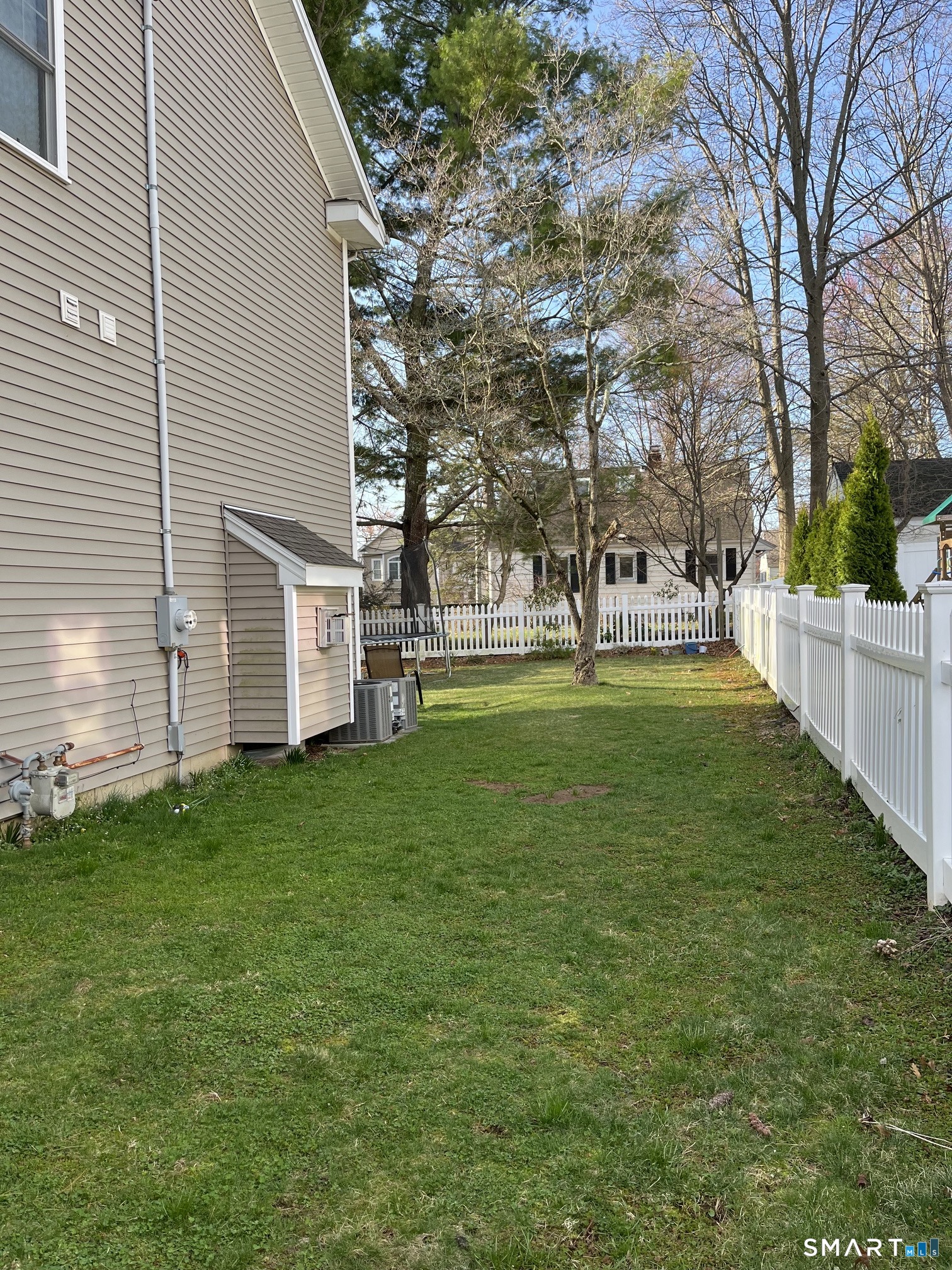 175 Alvin Street, Unit 175 Fairfield, CT 06825 - Photo 11 of 11 a garden with trees in front of it