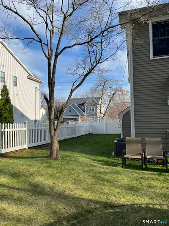 a garden with trees in front of it