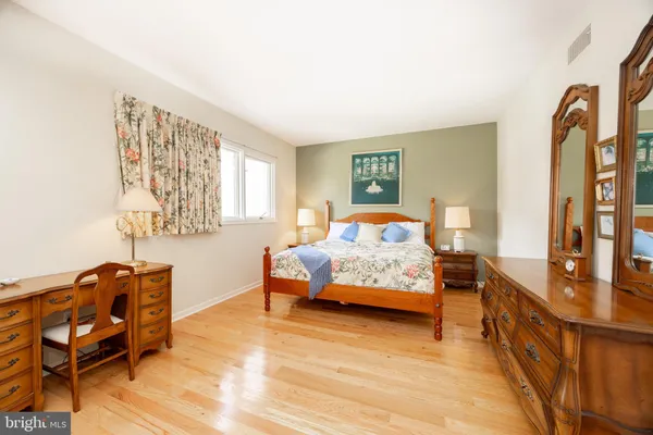 a bedroom with furniture and a window