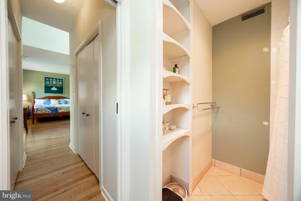 a spacious bedroom with a bed and a couch
