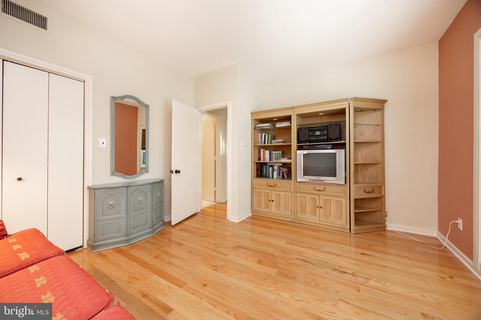 9 Avignon, Unit 9 Devon, PA 19333 - Photo 24 of 37 a bed room with a bed and cabinets